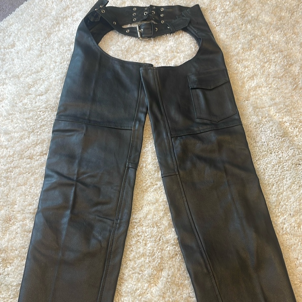 Brand new black leather chaps without tags.